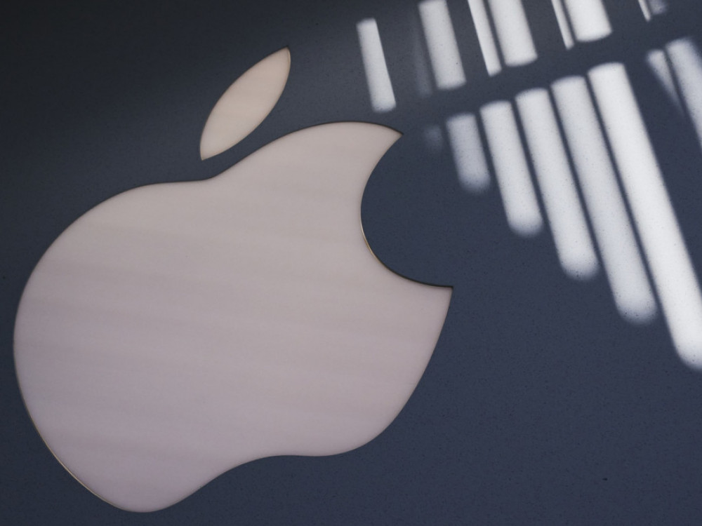 Apple z rastjo prihodkov in dobička, cena delnice upadla